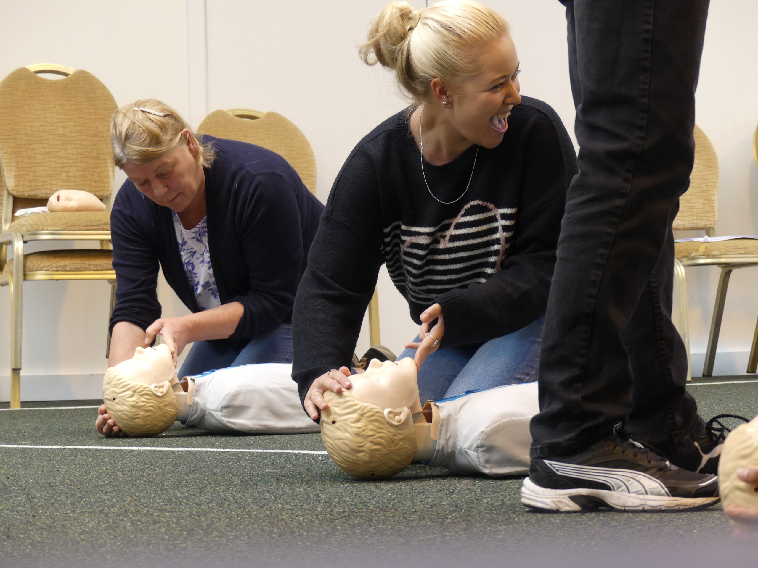 2 females enjoying learning about effective airway management 