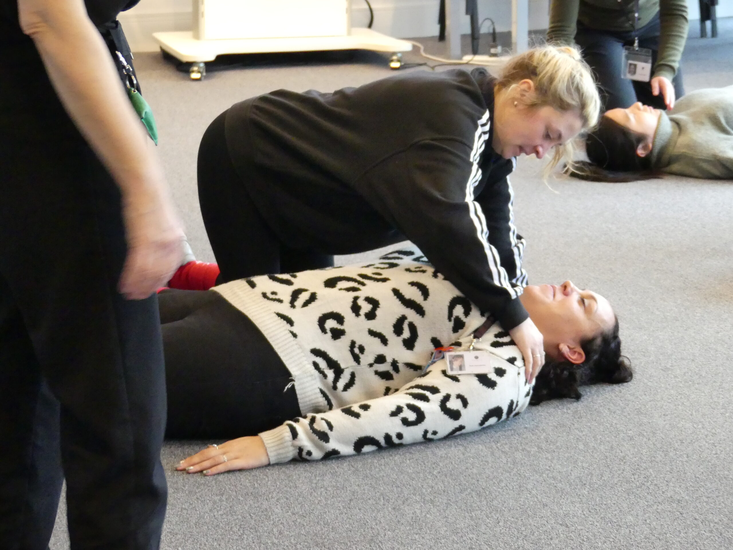 Learner practicing checking response on a first aid course